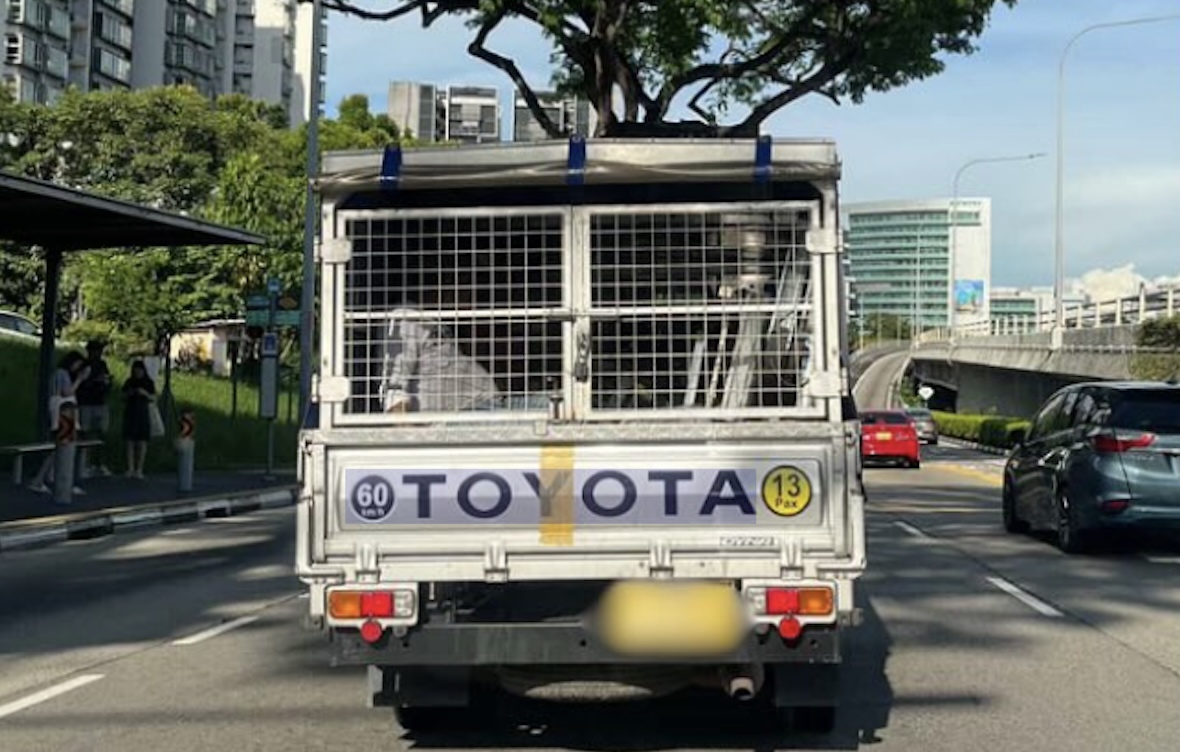 Netizens divided after seeing photo of migrant workers ferried in locked lorry